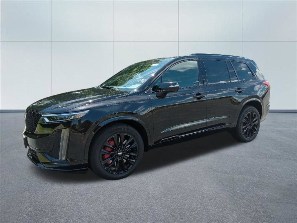 2024 Cadillac XT6 Sport in Stellar Black Metallic — front three-quarter view