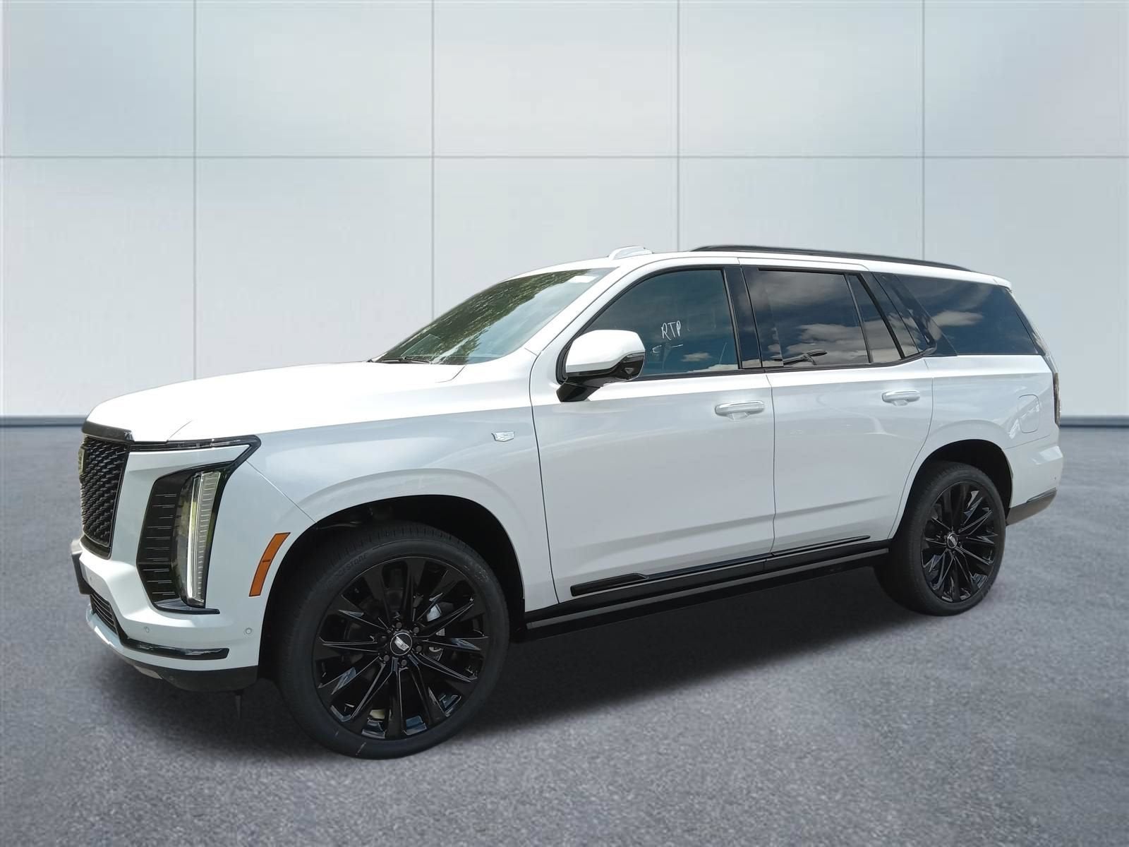 2026 Cadillac Escalade Platinum Sport in Vibrant White Tricoat — front three-quarter view