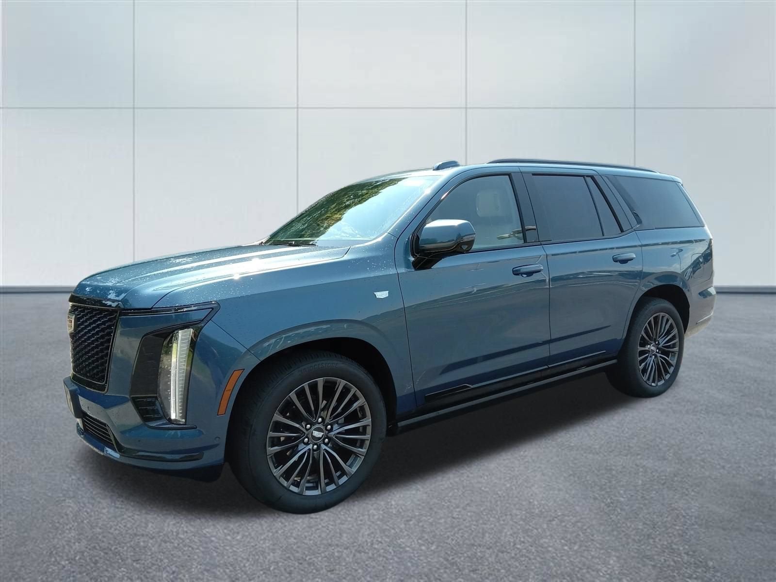 2026 Cadillac Escalade Platinum Sport in Deep Sea Metallic — front three-quarter view