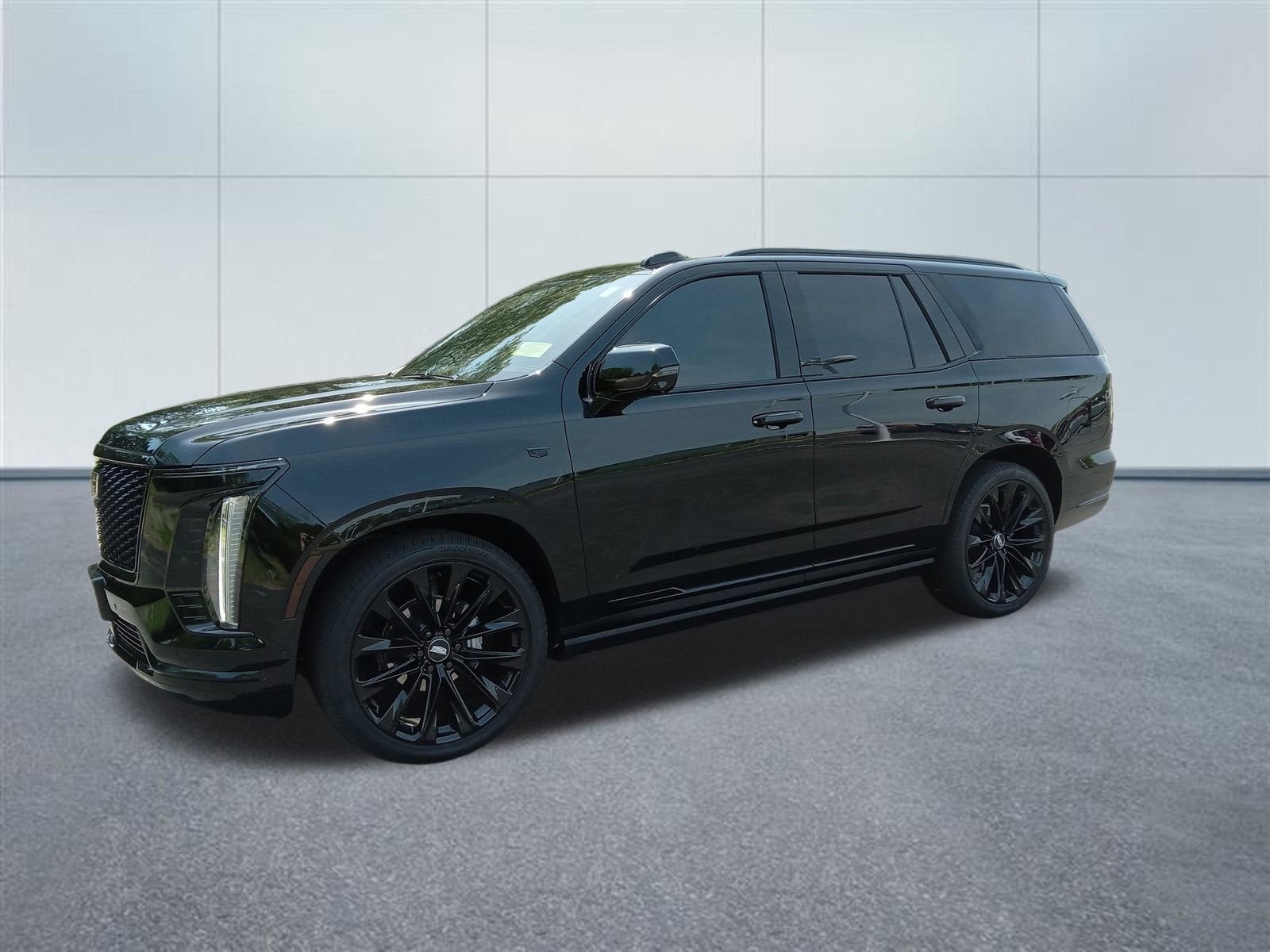 2026 Cadillac Escalade Platinum Sport in Black Raven — front three-quarter view